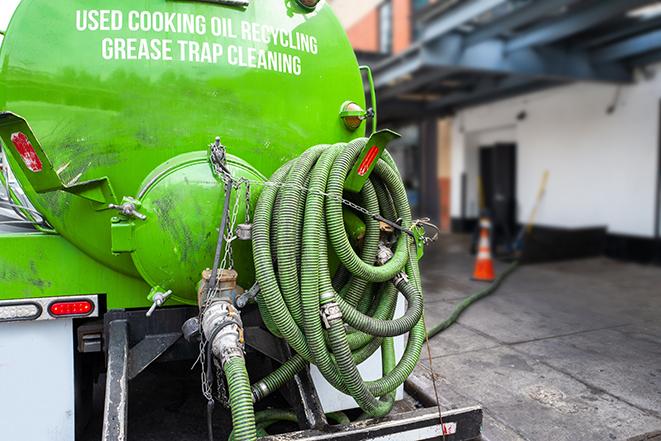 grease trap pumping equipment in action in Beverly Shores