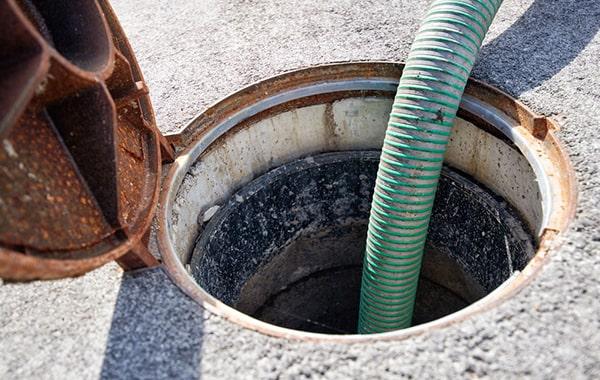 routinely scraping and removing grease, along with using enzyme-based cleaners, can help maintain a grease trap in between pumpings